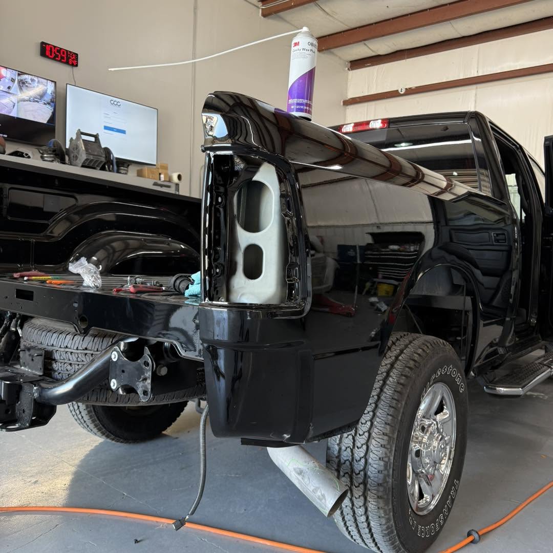 Freshly refinished black truck rear panel
